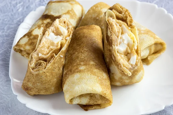 Pancakes stuffed with egg and cabbage. — Stock Photo, Image