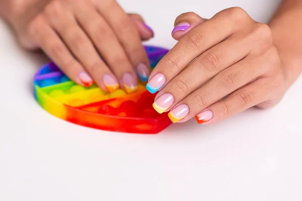 Beautiful Female Hands Colourful Manicure Nails Holding Toy Pop — Stock Photo, Image