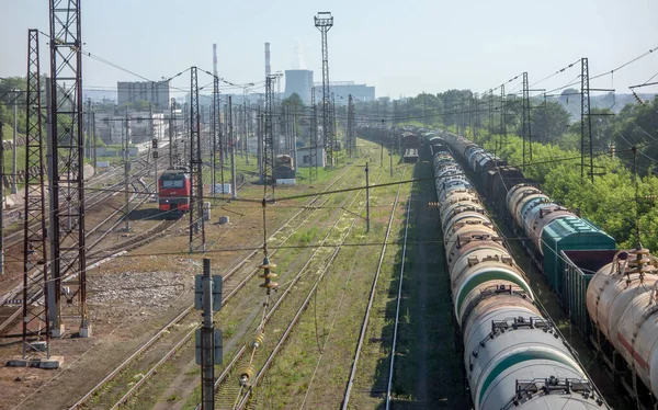 Railway tracks in the future. Train station near the city.