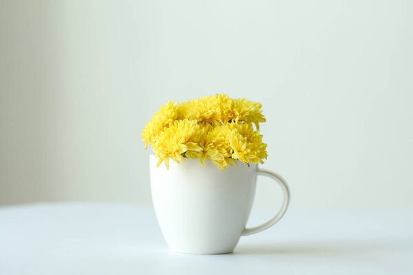 cup of tea with yellow flowers