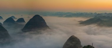 Sunrise and sea of clouds at the Dongtang Karst Peak Cluster in Libo County, Guizhou, China