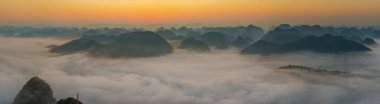 Sunrise and sea of clouds at the Dongtang Karst Peak Cluster in Libo County, Guizhou, China