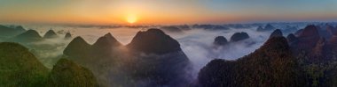 Sunrise and sea of clouds at the Dongtang Karst Peak Cluster in Libo County, Guizhou, China