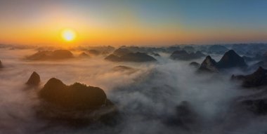 Sunrise and sea of clouds at the Dongtang Karst Peak Cluster in Libo County, Guizhou, China