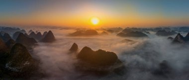Sunrise and sea of clouds at the Dongtang Karst Peak Cluster in Libo County, Guizhou, China