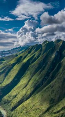 Time-lapse aerial footage of the Huajiang Canyon Bridge and Beipanjiang Canyon landscape in Guizhou, China.