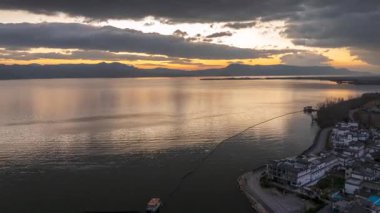 Time-lapse aerial view of sunrise over Erhai Lake in Dali, Yunnan, China