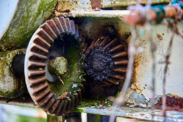 Old rusty gears in the lifting mechanism
