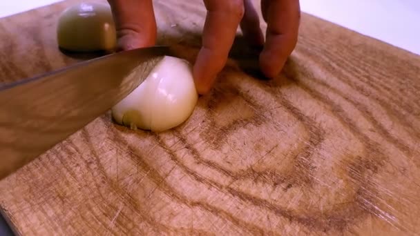Close View Cutting Halves Onion Smaller Pieces Hands Holding Knife — Stock Video