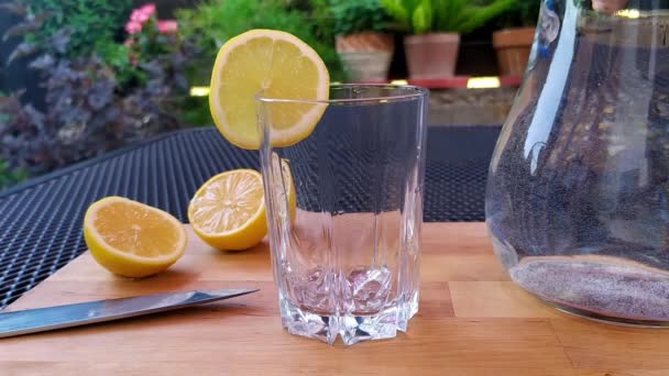 Close View Empty Glass Garden Table Which Water Poured Glass — Stock Video