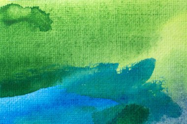 Kağıt dokusunda mavi ve yeşil suluboya, arkaplan tasarımı, elle boyanmış element