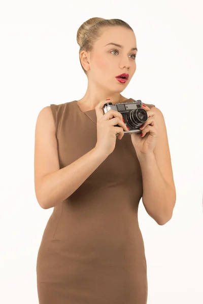 Girl with a camera on a white background — Stock Photo, Image