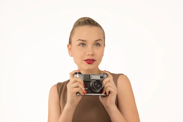 Girl with a camera on a white background — Stock Photo, Image