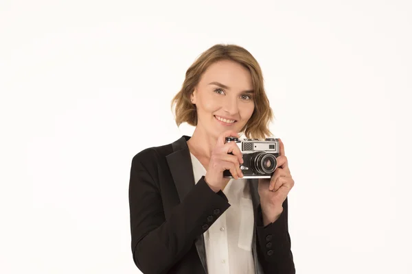 Fille avec un appareil photo sur un fond blanc — Photo