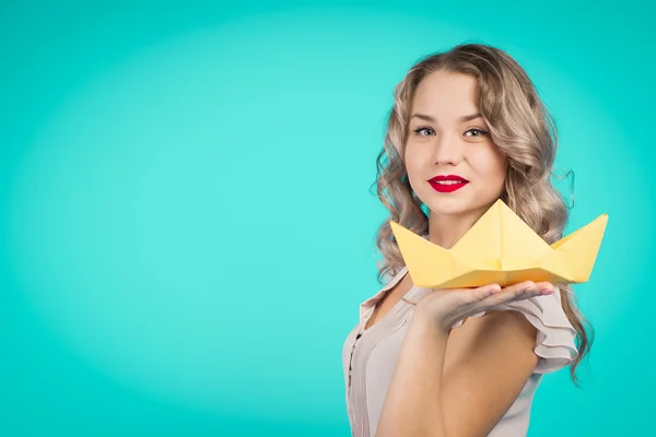 Girl holding a paper boat — Stock Photo, Image