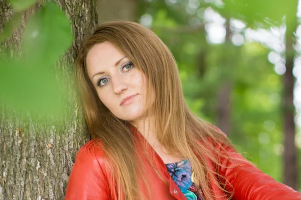 Beautiful blonde in summer park — Stock Photo, Image