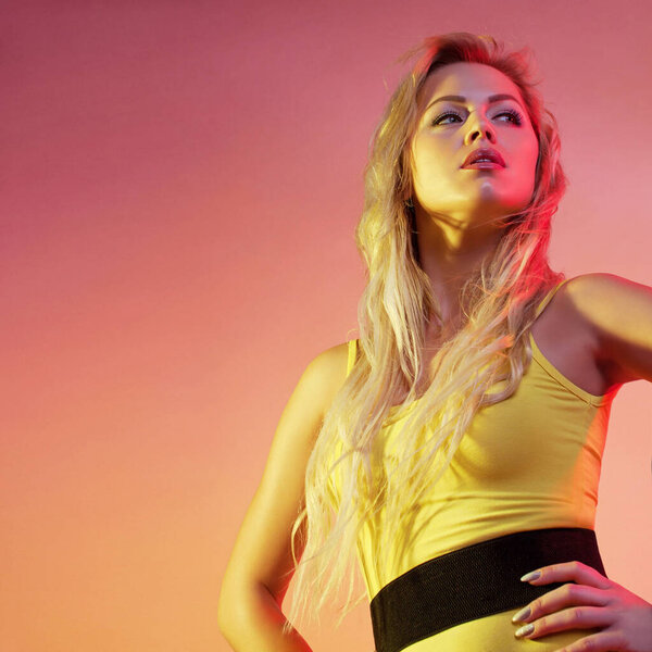 Attractive woman in colorful bright lights.