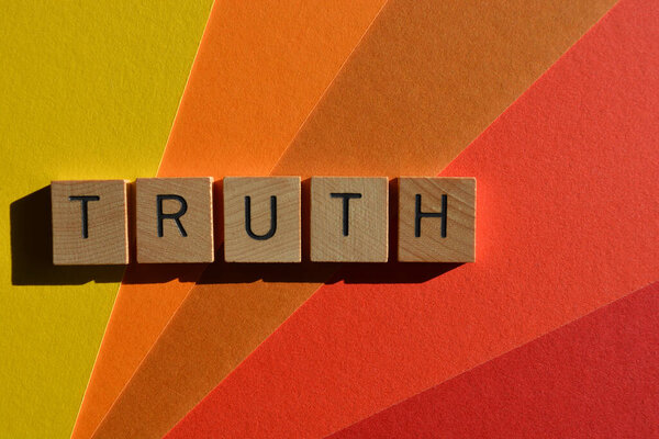 Truth, word in wooden alphabet letters isolated on colourful background with copy space