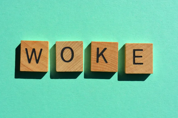 Woke Woord Houten Alfabet Letters Geïsoleerd Turquoise Achtergrond — Stockfoto