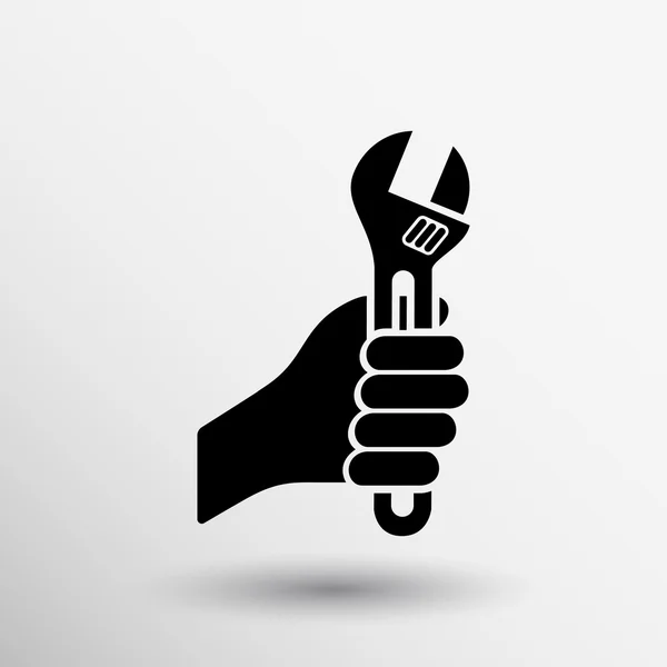 Hand holding moersleutel Tool icon vectorillustratie — Stockvector