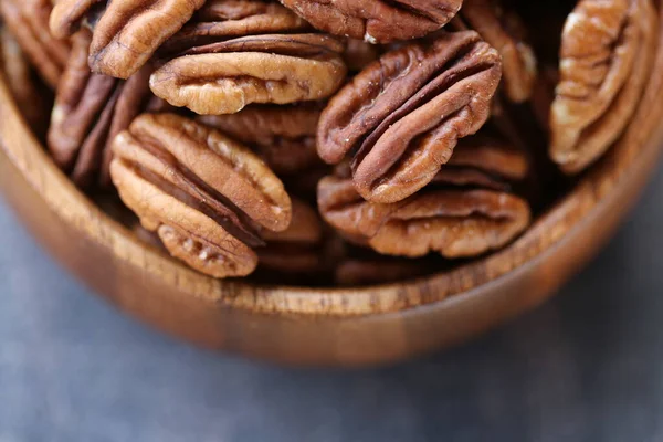 Pecan nut close-up in a round wooden cup .Nuts and seeds. .Healthy fats.Heap shelled Pecans nut closeup.keto diet.Tasty raw organic food snack — Stock Photo, Image