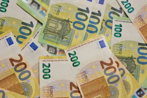 Money. Euro banknotes background.Finance and savings.Two hundred and one hundred euro banknotes.European Union currency — Stock Photo, Image