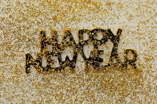 Happy New Year. Festive background.New Year lettering in gold glitter.Winter holidays time. — Stock Photo, Image