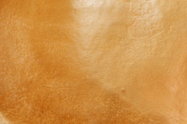 Shimmering gold texture.Festive New Year and Christmas Wallpaper.Matte gold wallpaper