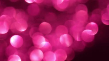 Pembe boke arka planı. Parıldayan dairesel bir model. Pembe tonlarda parlak duvar kâğıdı. 4k görüntü