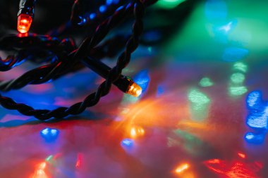Garland light wallpaper.Macro Shot of Christmas String Lights.