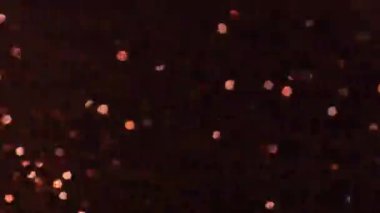 Koyu kahverengi parıltılı arka plan. Çikolata simli duvar kağıdı. Neşeli ışıltılı arka plan. Şükran günü, yeni yıl, doğum günü, Noel modeli. Mesaj için yer var. 4k görüntü