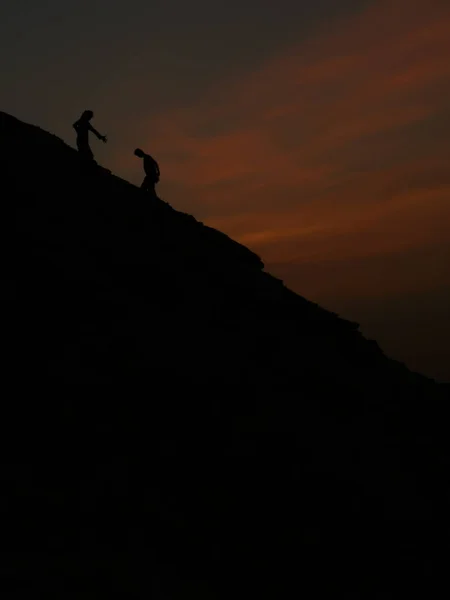 Man Helping Another Man Climb — Stock Photo, Image