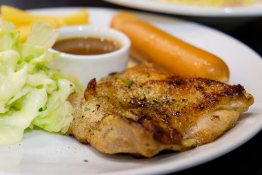 Chicken steak with sausage and vegetables 