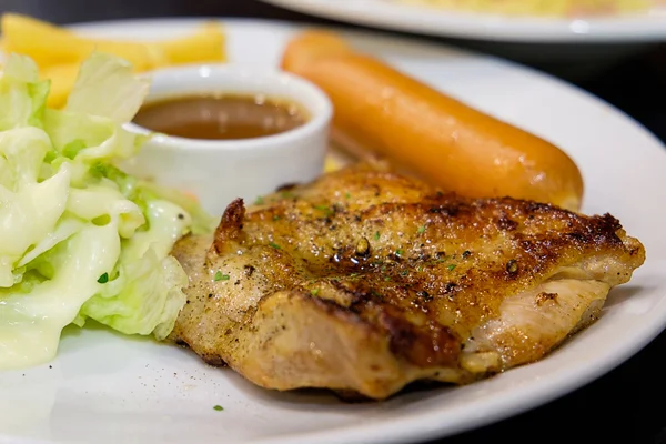 Chicken steak with sausage and vegetables 