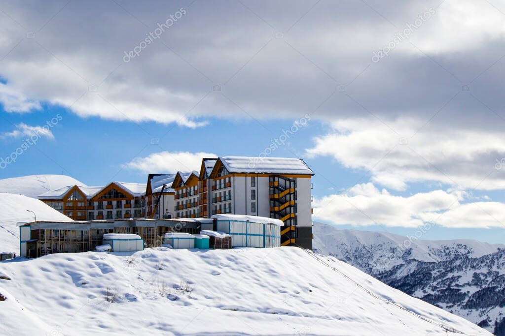 Gudauri, Georgia - February 06, 2021: Ski resort, snowy mountains and hostels.