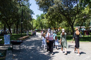Tbilisi, Georgia - July 05, 2021: People in the open air marketplace in the park.