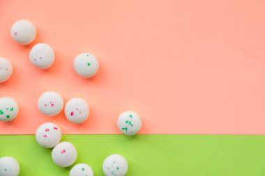 Candy on the pink and green background, gum