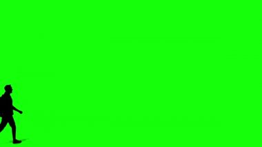 Yürüyen siluet adam çizgi film animasyonu. Döngü animasyonu (4K video). arkaplan şeffaf kullanımı için yeşil arkaplan 