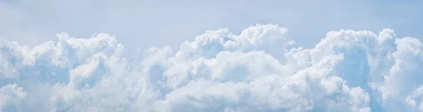 Light blue cumulus clouds texture, wide summer sky background