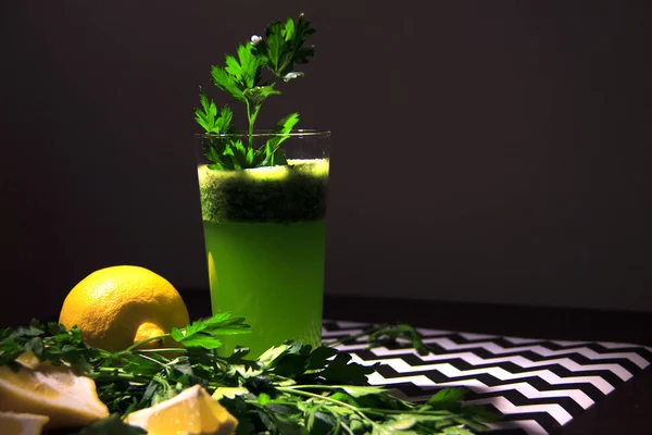 Green detox juice with parsley and lemon. Healthy eating concept.