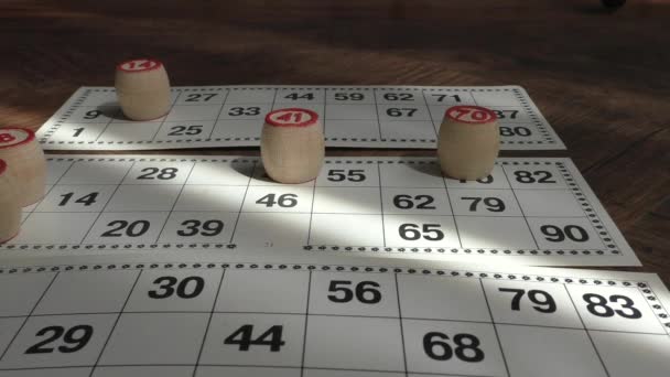 Traditional Game Russian Lotto Cards Numbers Closeup Wooden Barrels Numbers — Stock Video