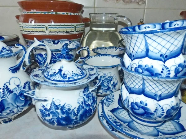 Tableware in the Russian traditional Gzhel style. Gzhel-Russian folk craft of ceramics and production porcelain and a kind of Russian folk painting.