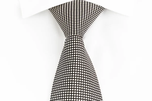 Black and white spotted tie knotted Windsor — Stock Photo, Image