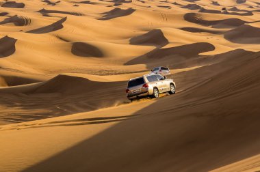 A desert safari in the red desert at Hatta near Dubai, UAE in springtime clipart
