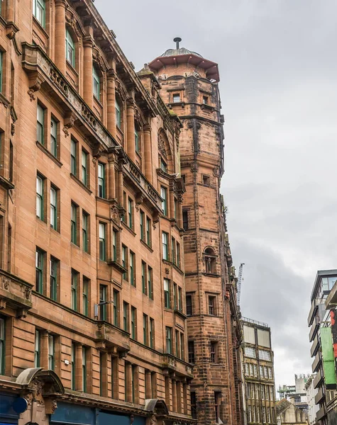 A view of red sandstone Victorian buildings  in Glasgow on a summers day