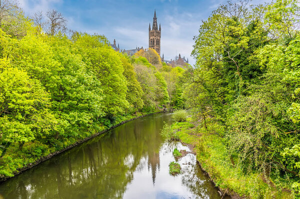 A view up the River Kelvin towards Glasgow University in Glasgow on a summers day