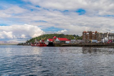 A view across the seafront and landing stage at Oban, Scotland on a summers day