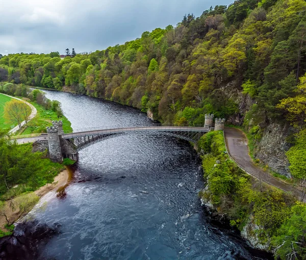 Stock image An aerial view down the River Spey towards the castellated tower bridge at Craigellachie, Scotland on a summers day