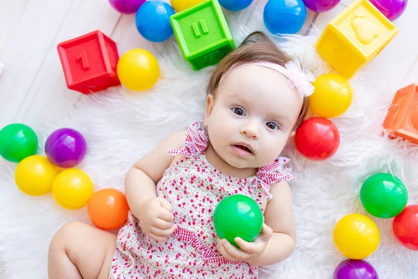 Beautiful Little Baby Girl Lying Red Clothes White Mat Toys — Stock Photo, Image