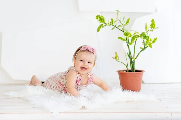 Small Child Girl Lying Her Stomach Bright White Room Red — Stock Photo, Image